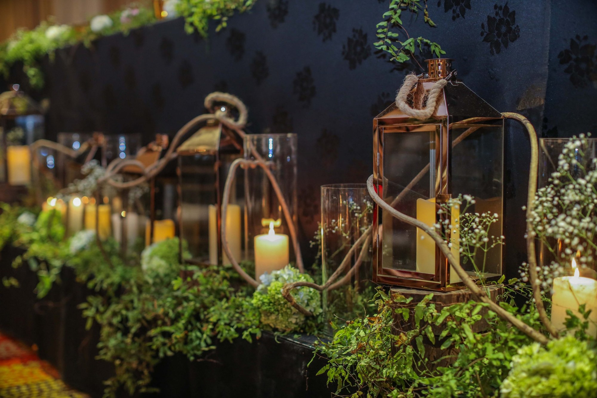 Candlelit floral styling and lanterns at a Kairos event
